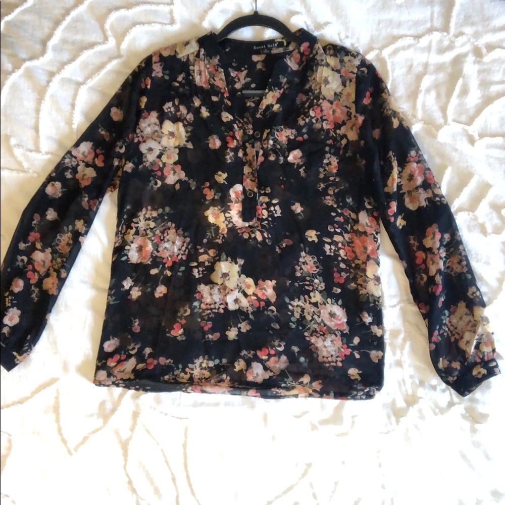 Sheer black floral long sleeve blouse.